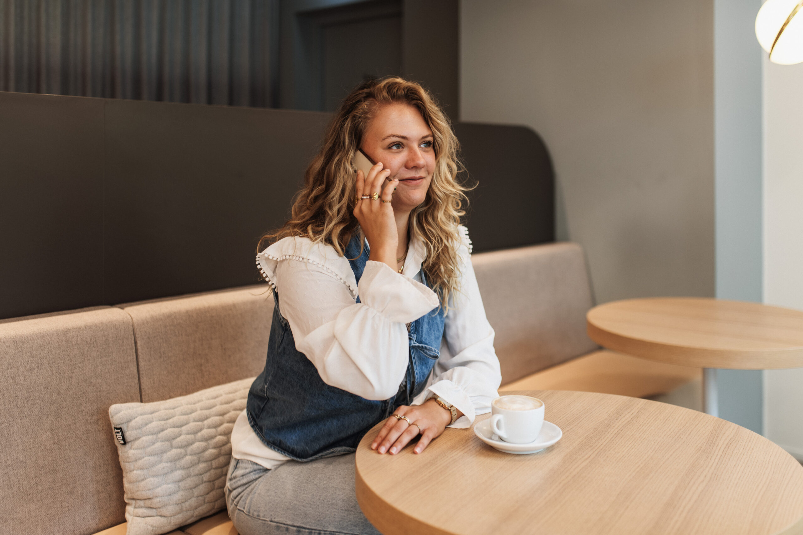 woman talking on her cell phone in a cafe