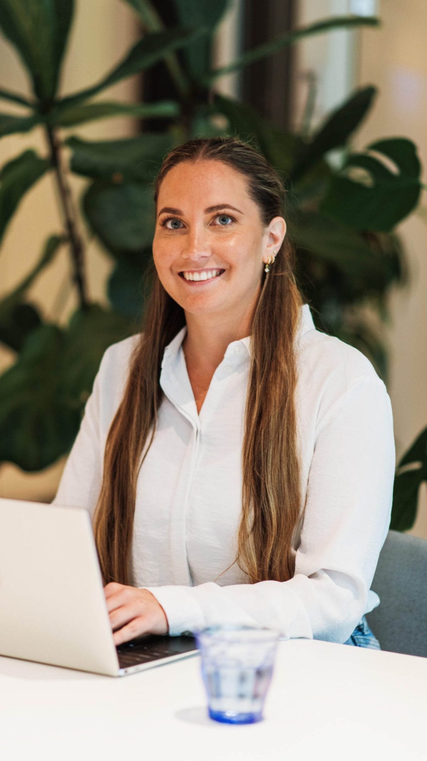 smiling DISA employee at her desk