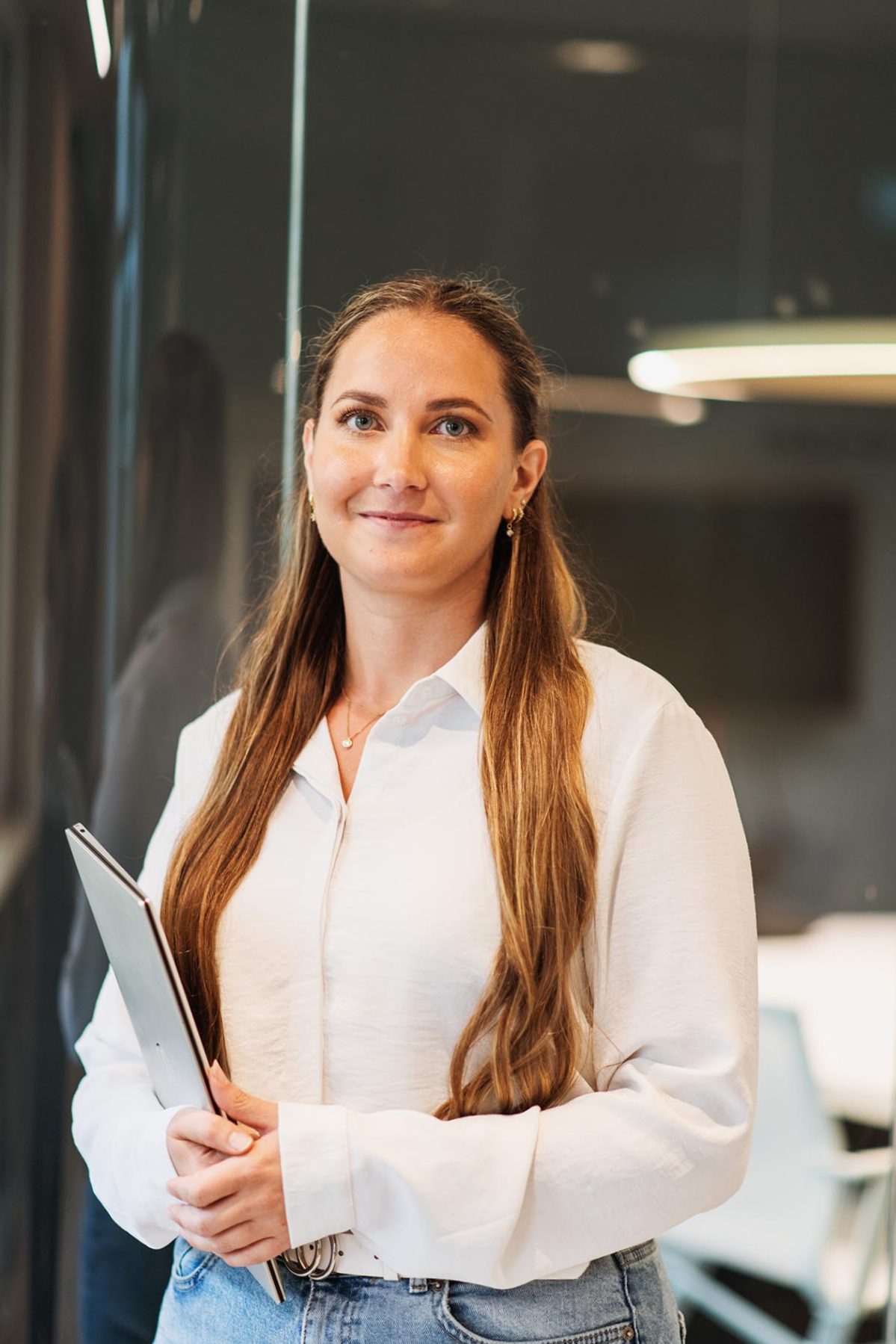 Woman in a white shirt in an office enviroment