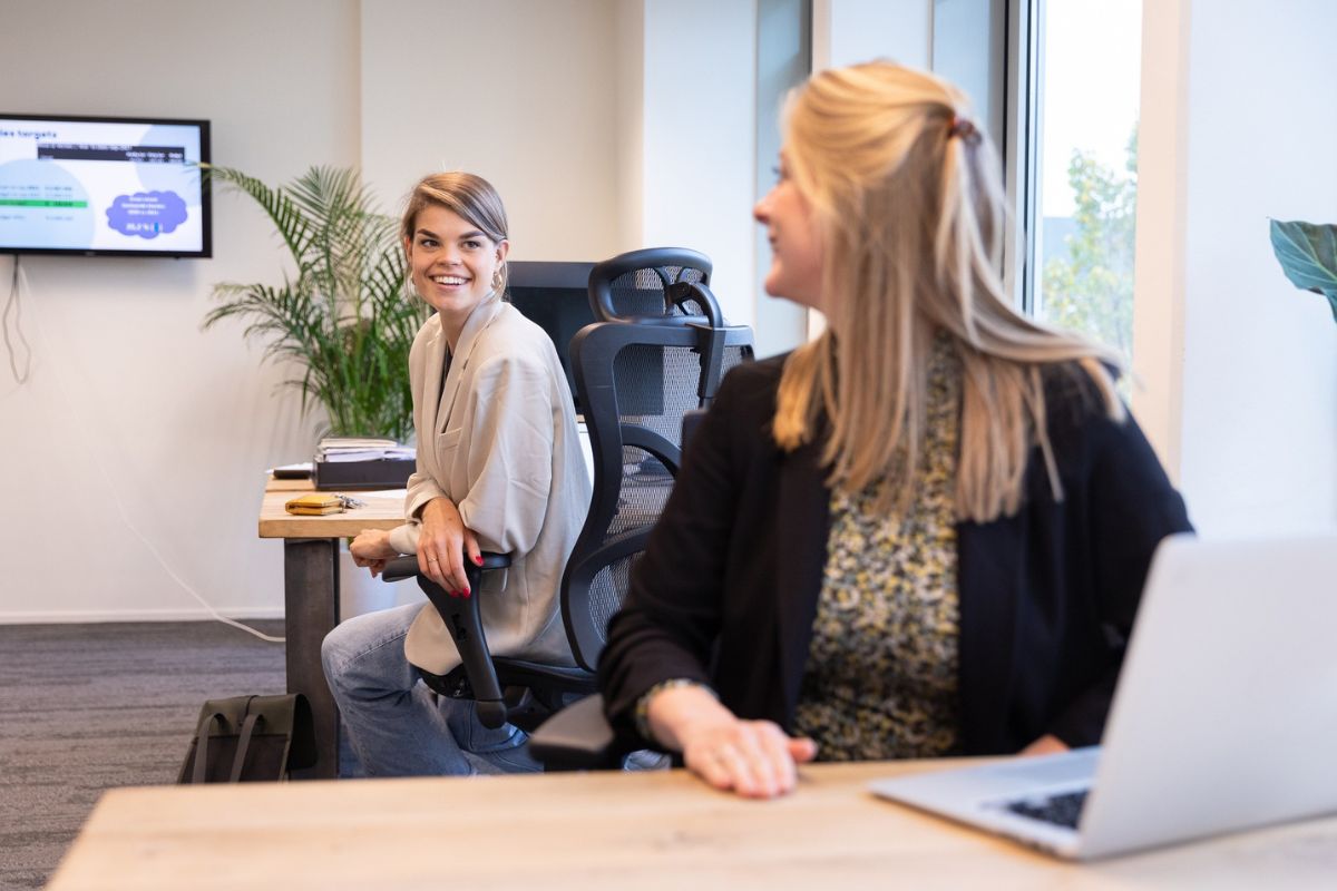 Two women talking with each other