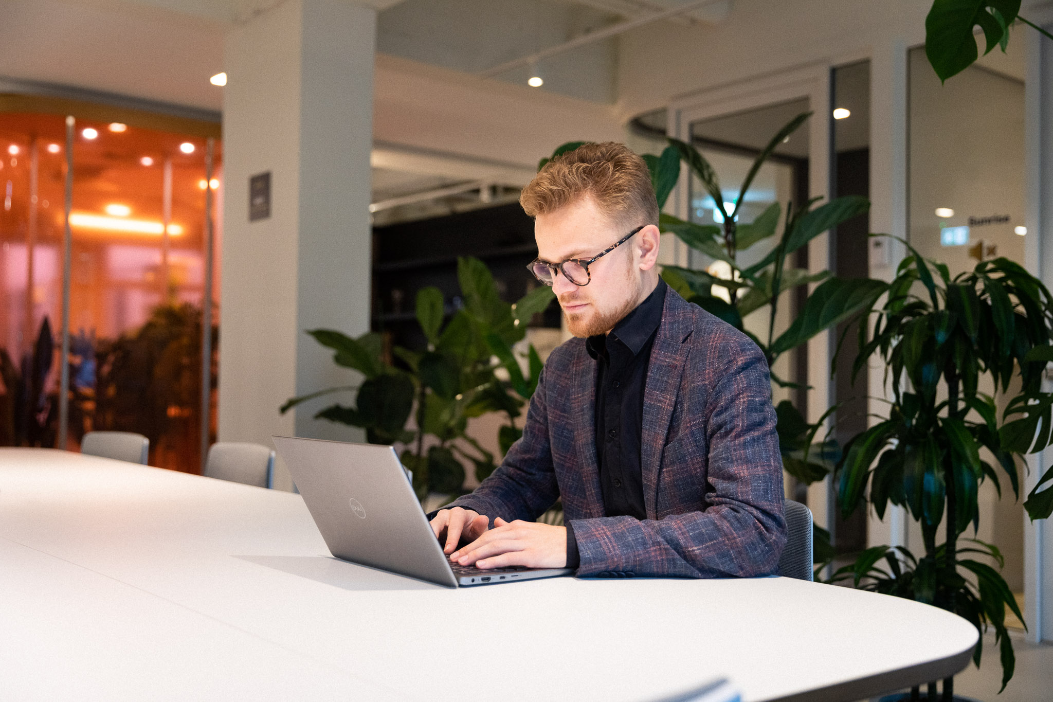 Man reading on the computer about that Critical infrastructure is under increasing pressure