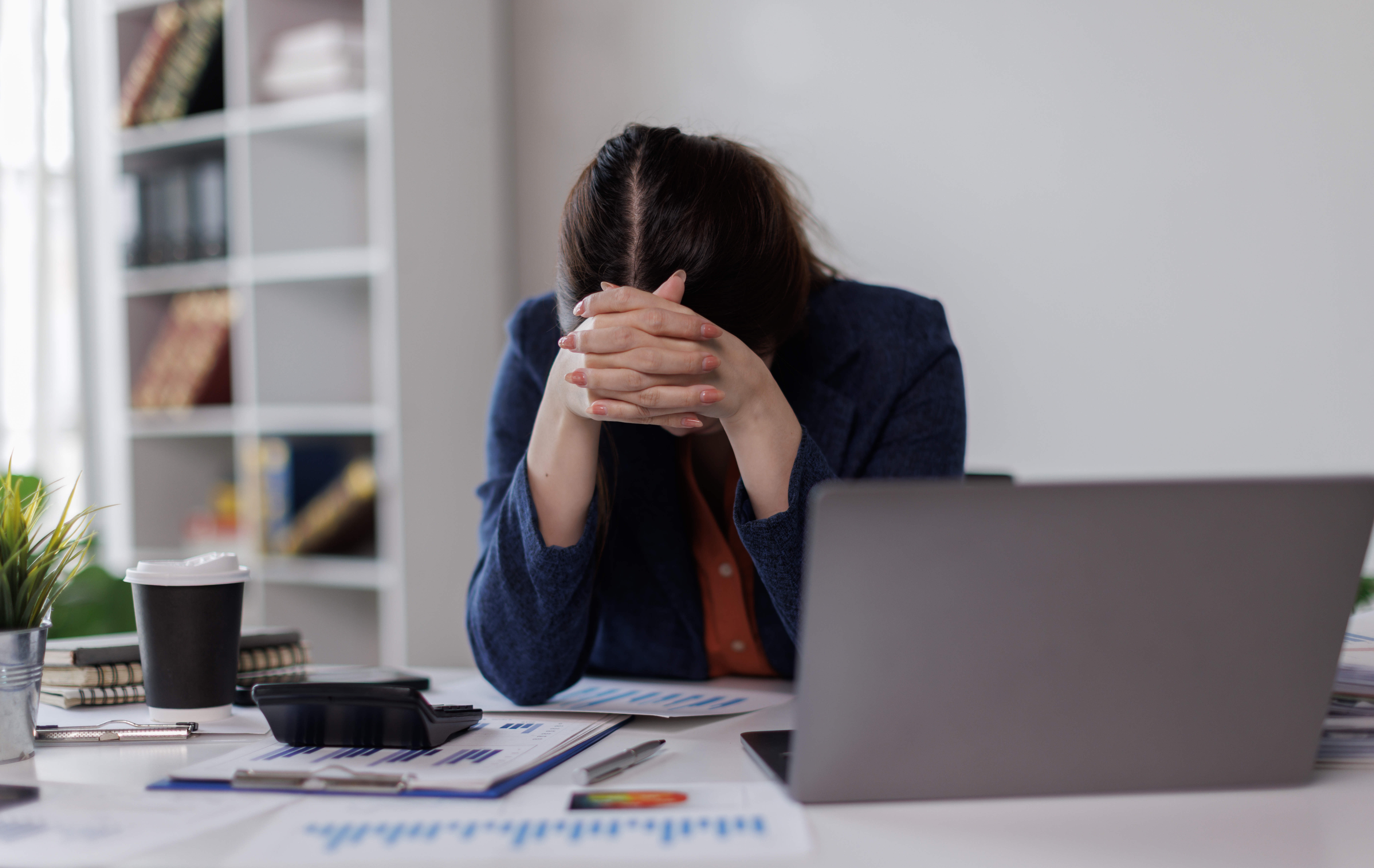 Tired woman sitting in an office