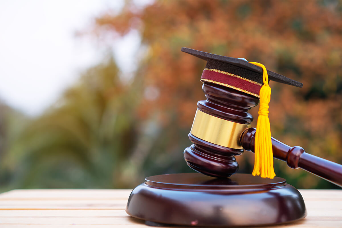 Graduation diploma hat and judge gavel