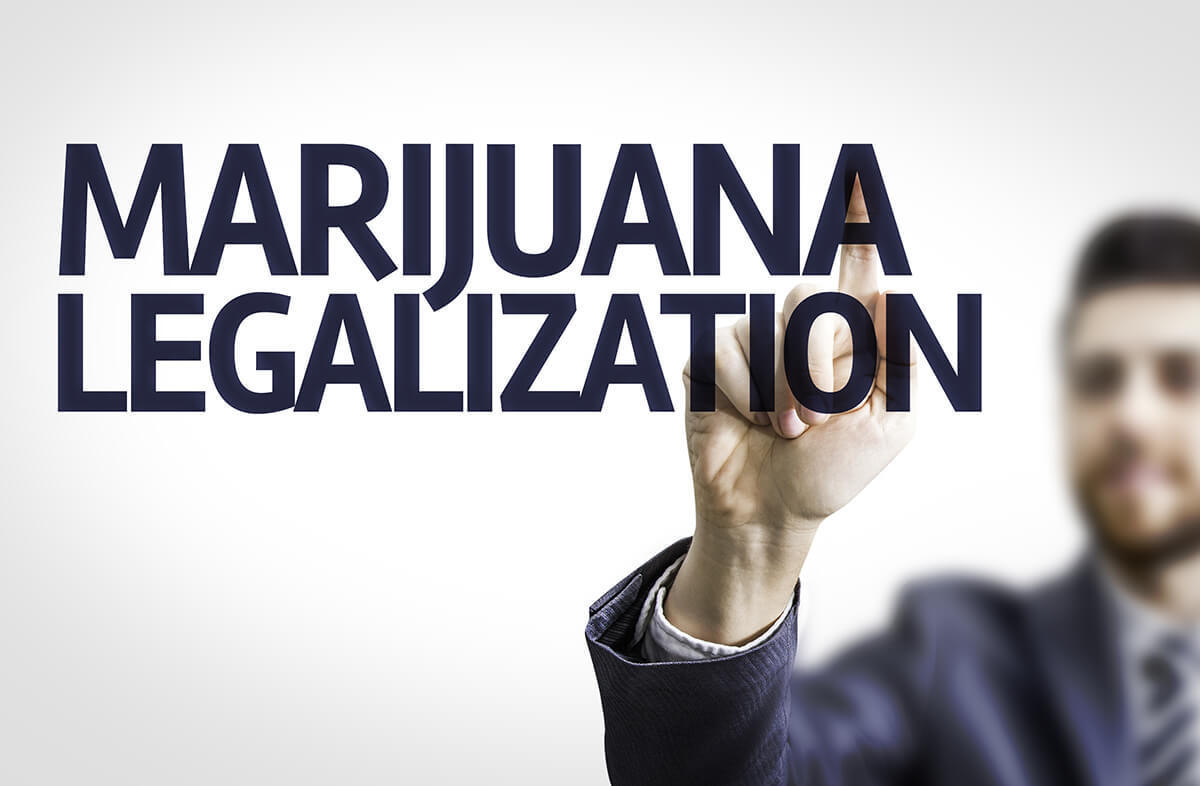 Person pointing at the words "Marijuana Legalization"