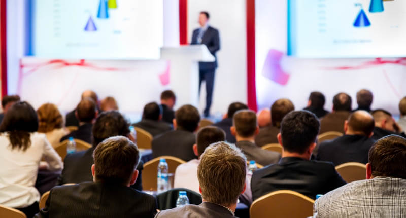 People at the conference listening to presentation