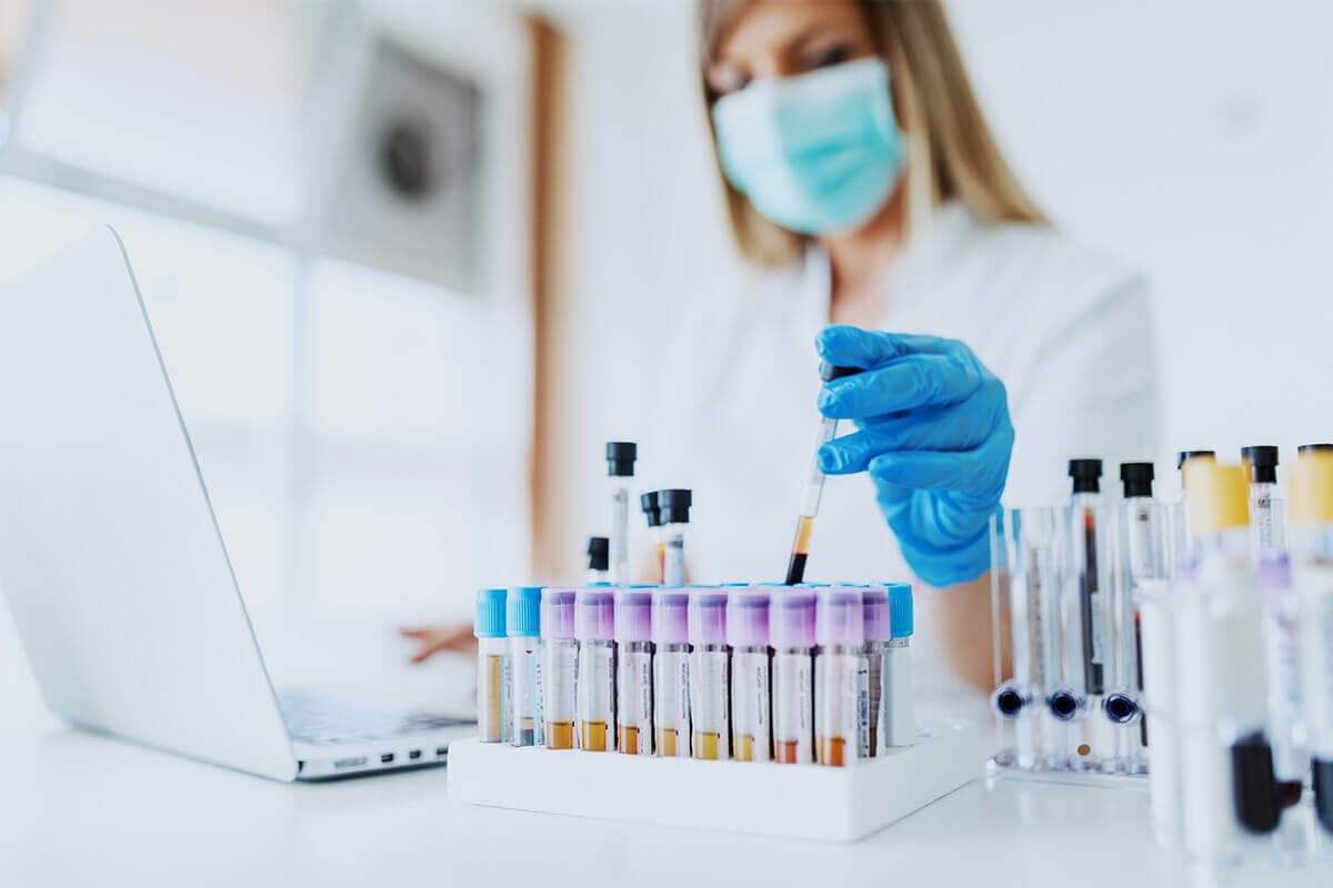 medical technician performing random drug testing in a lab