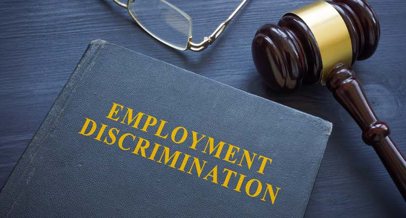 Law about employment discrimination and gavel on the table