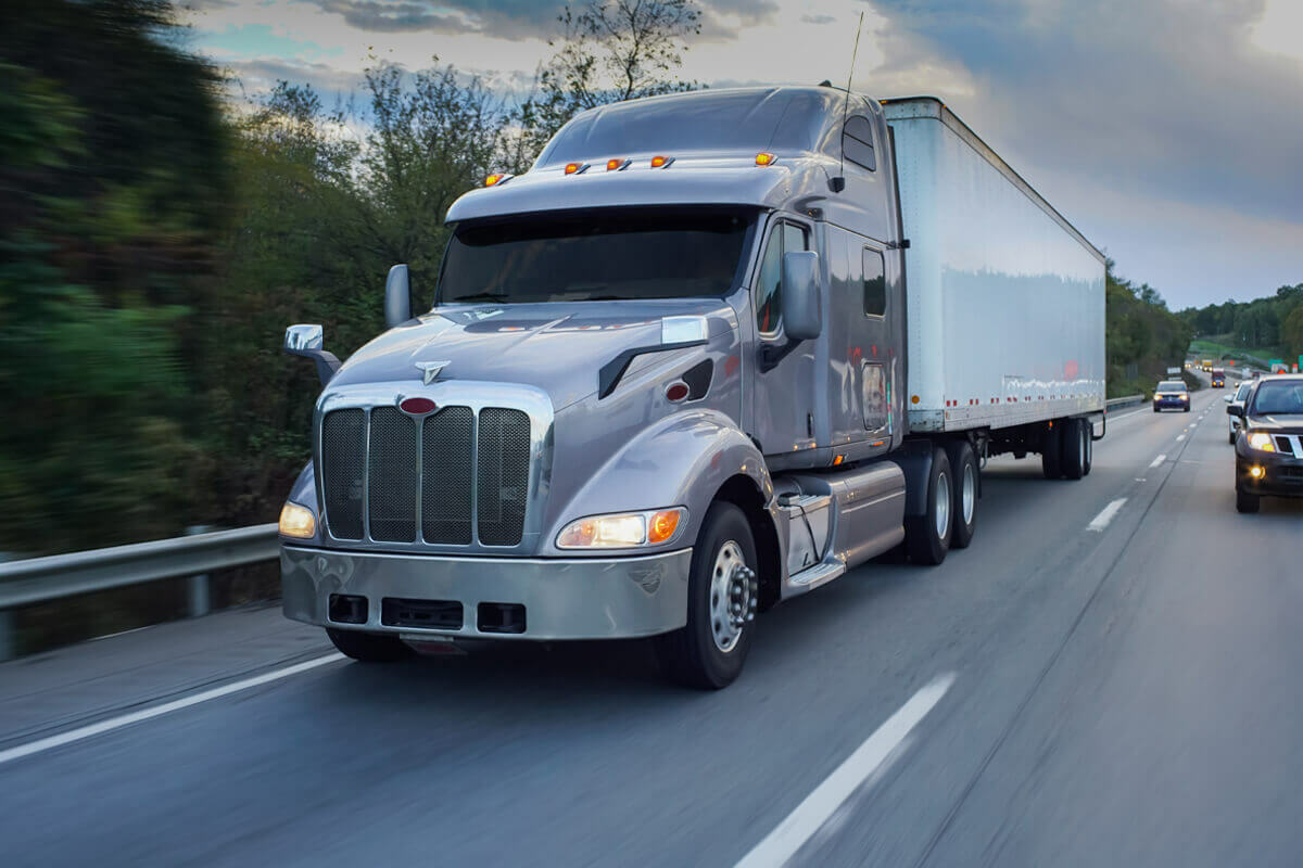 Long Haul Transportation truck driving across state on highway