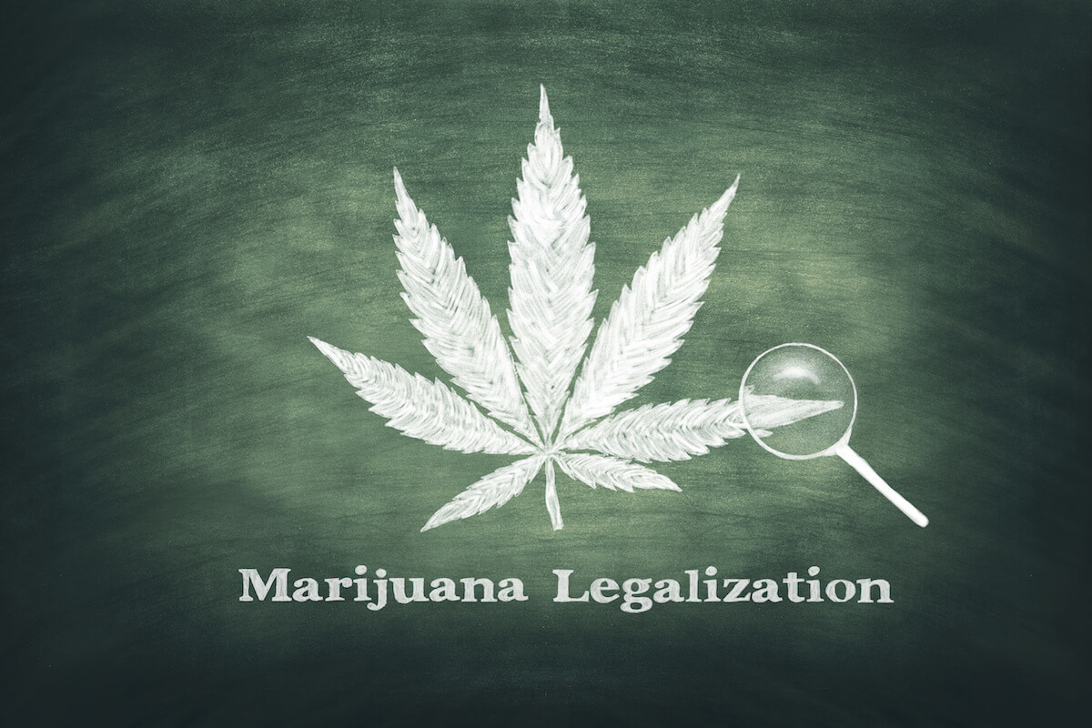 Marijuana leaf on a green chalkboard