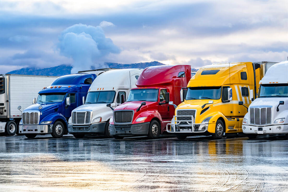 several trucks parked and lined up in a row