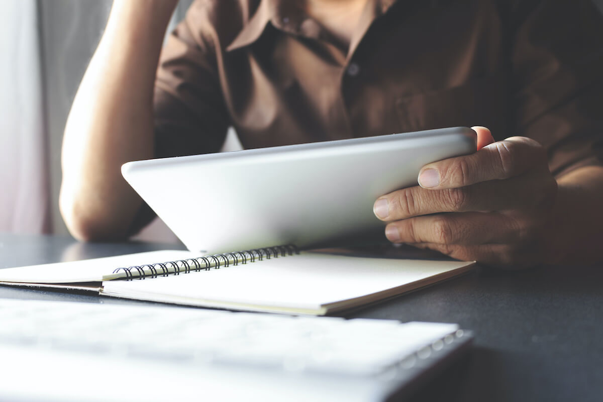 person reading on tablet