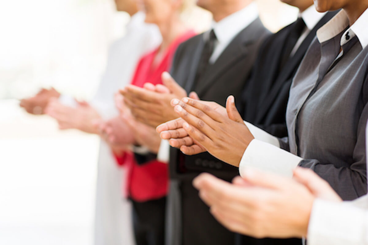 business people clapping hands
