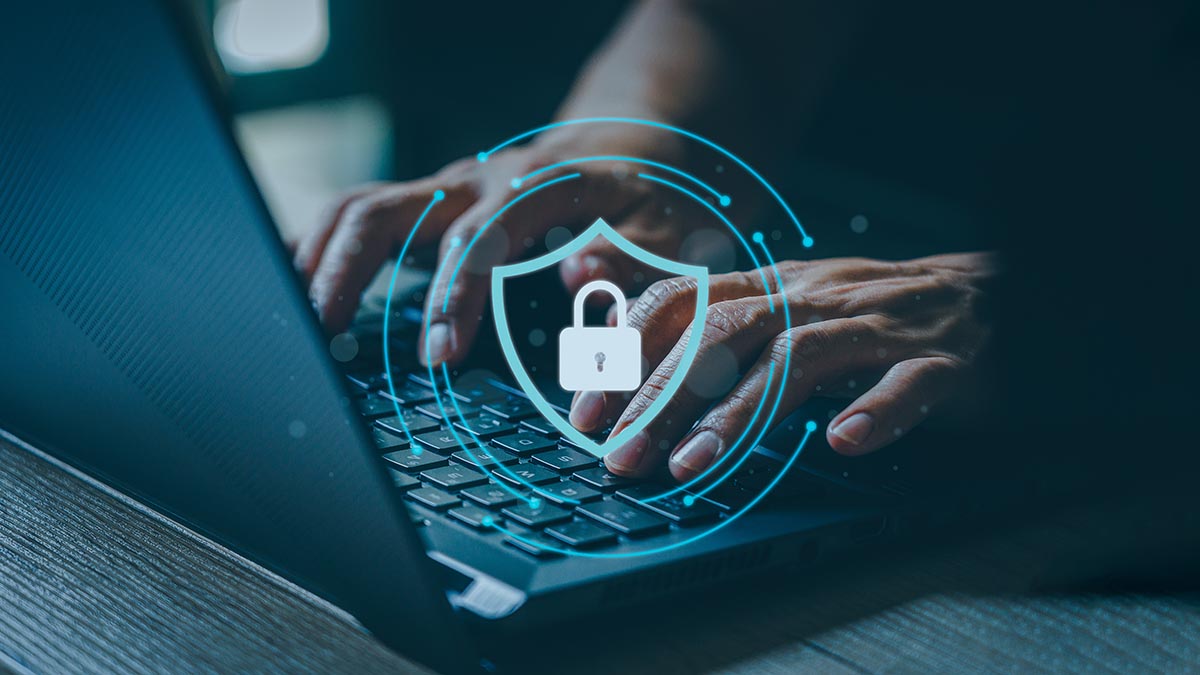 Person working on a computer with cybersecurity