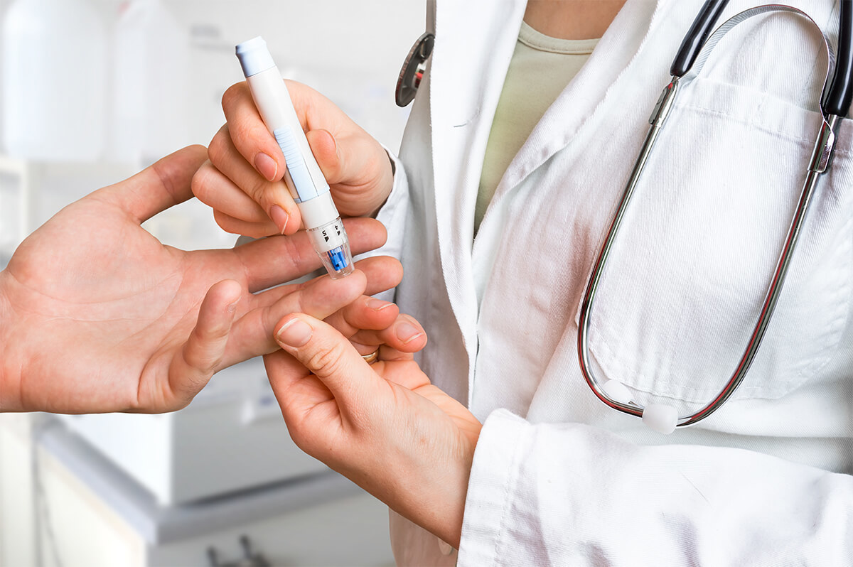 patient doctor measuring blood sugar