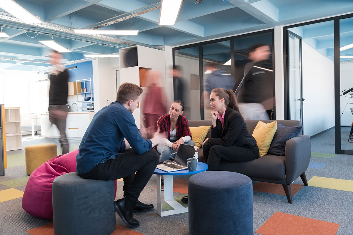 A group of employees sitting and having a discussion