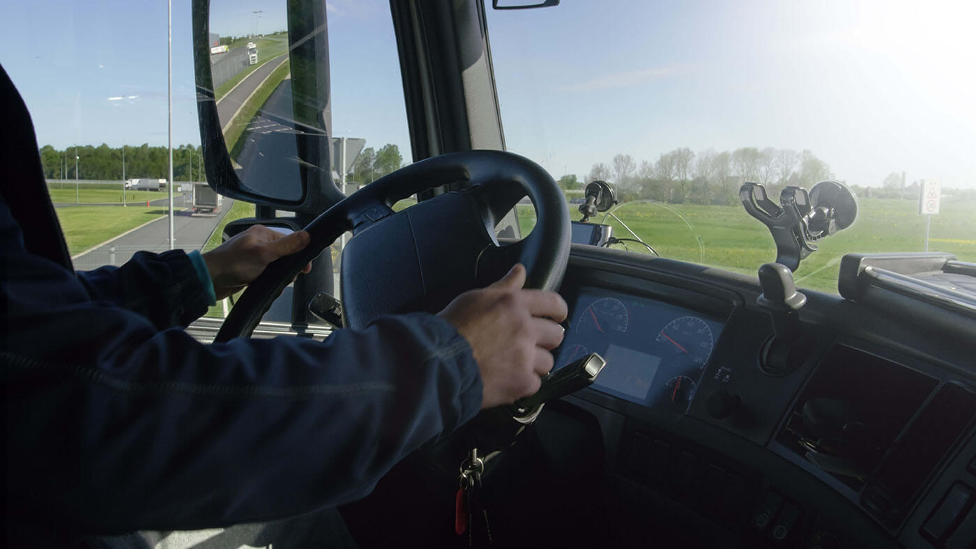 closeup photo of a man driving a large vehicle