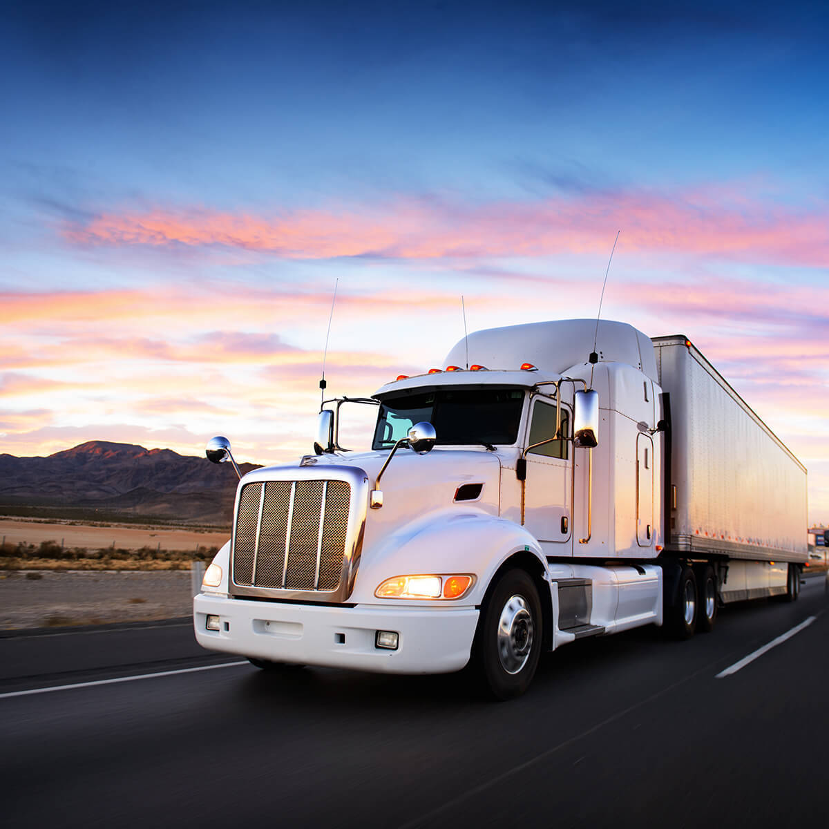 truck driving at sunrise